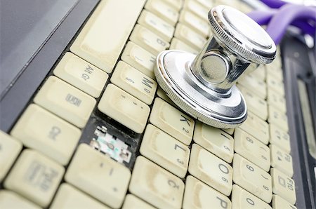 simsearch:400-05244427,k - Stethoscope on old and dirty laptop keyboard. Stock Photo - Budget Royalty-Free & Subscription, Code: 400-06867152