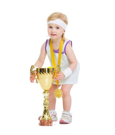 simsearch:400-06867373,k - Happy baby in tennis clothes holding medal and goblet Stockbilder - Microstock & Abonnement, Bildnummer: 400-06867375