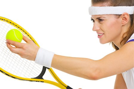 simsearch:640-03264942,k - Closeup on female tennis player serving ball Stock Photo - Budget Royalty-Free & Subscription, Code: 400-06867385