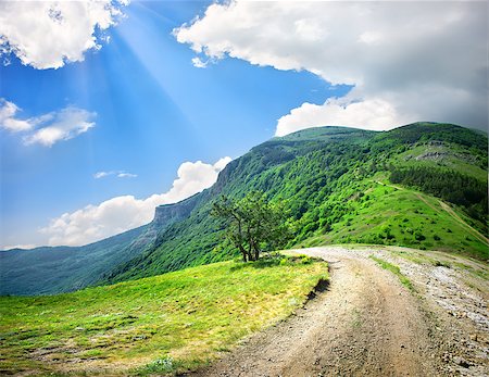 simsearch:400-06892091,k - Country road in the mountains in the afternoon Photographie de stock - Aubaine LD & Abonnement, Code: 400-06867510