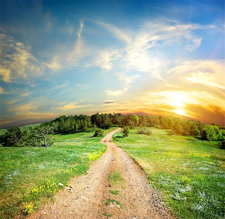 simsearch:400-07189007,k - Country road in the mountains at sunset Fotografie stock - Microstock e Abbonamento, Codice: 400-06867511