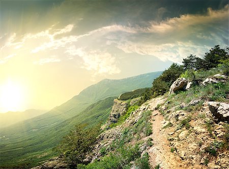 Country road in the mountains at sunset Stockbilder - Microstock & Abonnement, Bildnummer: 400-06867533