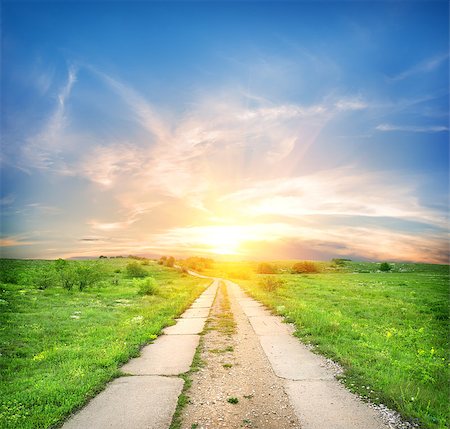 simsearch:400-07189007,k - Concrete road in a green spring field Fotografie stock - Microstock e Abbonamento, Codice: 400-06867549