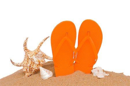 pair of orange sandals seashellsin sand isolated on white background Foto de stock - Super Valor sin royalties y Suscripción, Código: 400-06867633