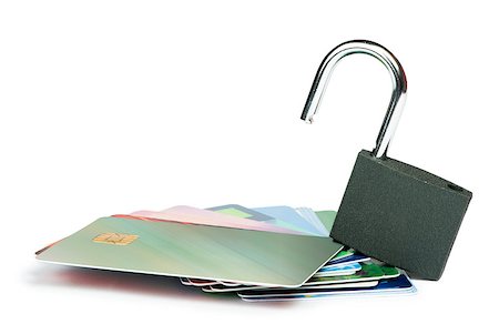 simsearch:400-04994290,k - Grey locked padlock and credit cards. Isolated studio shot. Fotografie stock - Microstock e Abbonamento, Codice: 400-06867837