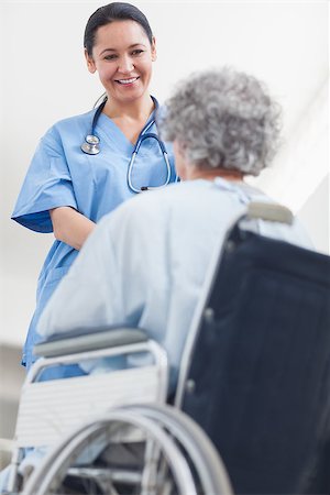 simsearch:400-07337135,k - Nurse talking to a patient in a wheelchair in a hospital Stock Photo - Budget Royalty-Free & Subscription, Code: 400-06867986