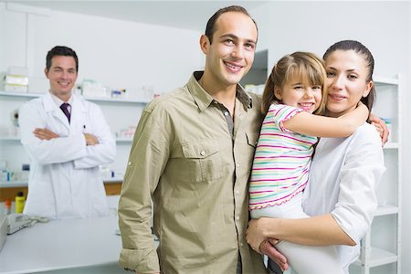 Smiling family and a pharmacist in the pharmacy of a hospital Stock Photo - Budget Royalty-Free & Subscription, Code: 400-06868069