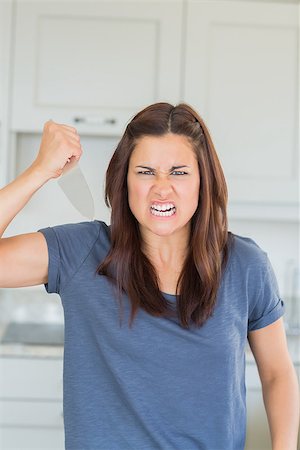 Angry woman holding knife threatingly Stock Photo - Budget Royalty-Free & Subscription, Code: 400-06868184