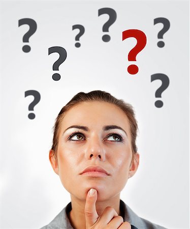 person thinking with question mark'''''''' - Woman thinking with question marks abover head on white background Stock Photo - Budget Royalty-Free & Subscription, Code: 400-06868467