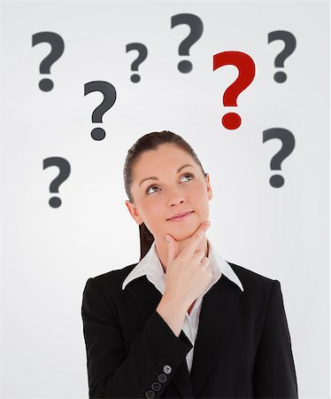 person thinking with question mark'''''''' - Smiling businesswoman thinking with question marks abover her on white background Stock Photo - Budget Royalty-Free & Subscription, Code: 400-06868468