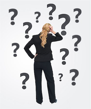 Quizzical businesswoman with back to camera on white background with balck question marks Stock Photo - Budget Royalty-Free & Subscription, Code: 400-06868460