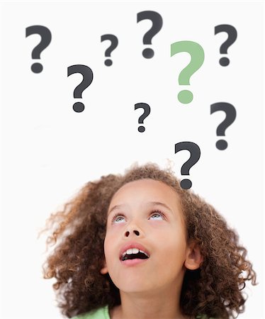 person thinking with question mark'''''''' - Thinking child with question marks above her on white background looking up Stock Photo - Budget Royalty-Free & Subscription, Code: 400-06868473