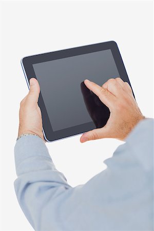 ereader hand - Closeup of hands using digital tablet over white background Stock Photo - Budget Royalty-Free & Subscription, Code: 400-06868608