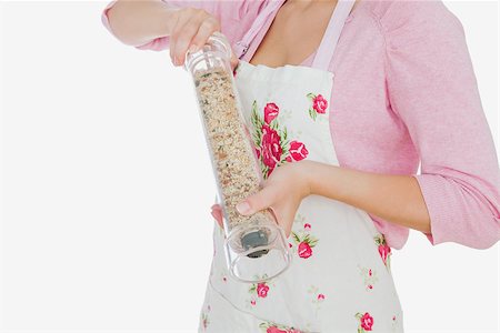 Maid grinding pepper over white background Stock Photo - Budget Royalty-Free & Subscription, Code: 400-06868868