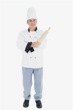 Full length portrait of male chef holding rolling pin over white background Stock Photo - Budget Royalty-Free & Subscription, Code: 400-06869082