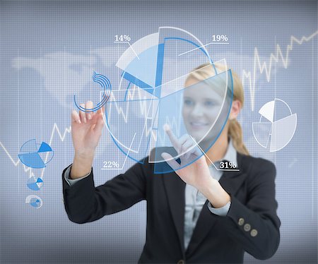 simsearch:400-06802290,k - Smiling businesswoman working with graphs on touch screen Stock Photo - Budget Royalty-Free & Subscription, Code: 400-06869595