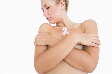 simsearch:400-06870717,k - Naked young woman with breast cancer ribbon over white background Stock Photo - Budget Royalty-Free & Subscription, Code: 400-06869939