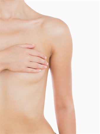 simsearch:400-06870717,k - Naked woman covering her breast over white background Stock Photo - Budget Royalty-Free & Subscription, Code: 400-06869941
