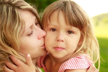 Mama and her little daughter playing on grass Stock Photo - Budget Royalty-Free & Subscription, Code: 400-06860040