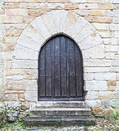 Ancient wooden door with stone frame Stock Photo - Budget Royalty-Free & Subscription, Code: 400-06860211