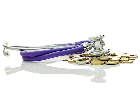 simsearch:400-06860365,k - Stethoscope on bunch of coins representing concept of economic crisis recovery. Stock Photo - Budget Royalty-Free & Subscription, Code: 400-06860350