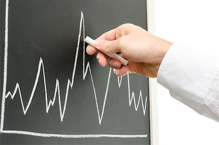 simsearch:400-06202045,k - Side view of a businessman hand presenting graph with a chart on a black board. Foto de stock - Super Valor sin royalties y Suscripción, Código: 400-06860379