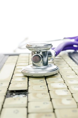 simsearch:400-05244427,k - Detail of stethoscope on an old and dirty laptop keyboard missing a key. Concept of computer service. Stock Photo - Budget Royalty-Free & Subscription, Code: 400-06860381