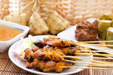 Chicken satay, ketupat or malay rice dumpling, lemang, rendang. Traditional Malay food, ramadan dish. Malaysian cuisine. Stock Photo - Budget Royalty-Free & Subscription, Code: 400-06860633