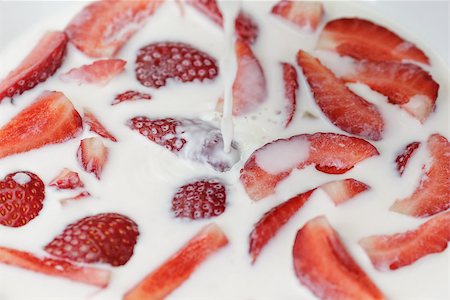 simsearch:400-04167332,k - flowing milk splashes on sliced strawberry, close up Stock Photo - Budget Royalty-Free & Subscription, Code: 400-06860671