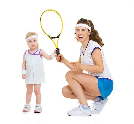 simsearch:400-06867373,k - Happy mother and baby holding tennis racket Stockbilder - Microstock & Abonnement, Bildnummer: 400-06861468