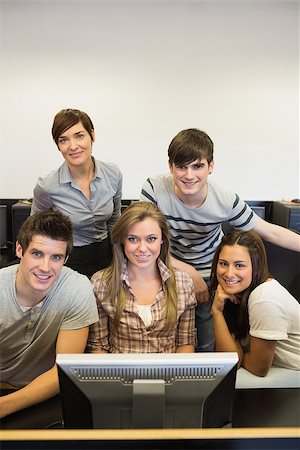 Happy teacher with her computer class in college Stock Photo - Budget Royalty-Free & Subscription, Code: 400-06862397