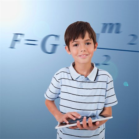 Male pupil with tablet pc on background with maths formula Stock Photo - Budget Royalty-Free & Subscription, Code: 400-06862432