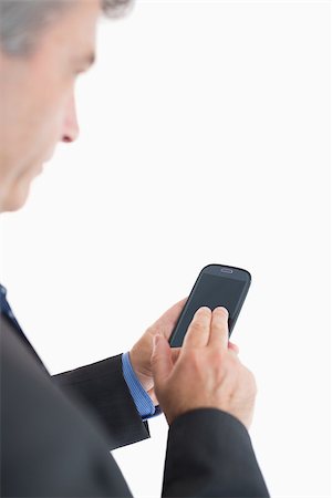 Businessman using smartphone Stock Photo - Budget Royalty-Free & Subscription, Code: 400-06862605