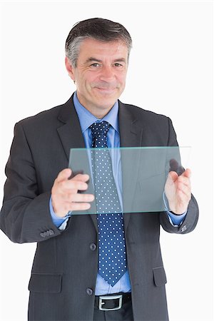 slide business man - Cheerful businessman holding a pane Stock Photo - Budget Royalty-Free & Subscription, Code: 400-06862600