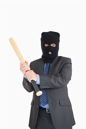 simsearch:400-06803573,k - Smiling businessman holding a baseball bat and wearing a balaclava Stock Photo - Budget Royalty-Free & Subscription, Code: 400-06862612