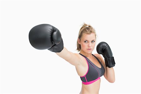 fists in the air sport - Woman in boxing gloves punching the air Stock Photo - Budget Royalty-Free & Subscription, Code: 400-06862961