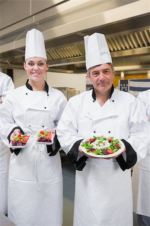 simsearch:400-06863053,k - Chef's presenting their salads in the kitchen Stockbilder - Microstock & Abonnement, Bildnummer: 400-06863054