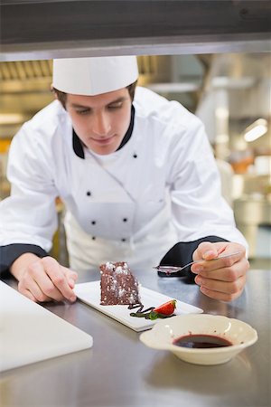 Chef putting berry coulis on the dessert in the kitchen Stock Photo - Budget Royalty-Free & Subscription, Code: 400-06863148