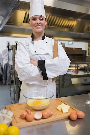 pastry chef uniform for women - Pastry chef with rolling pin making dough in the kitchen Stock Photo - Budget Royalty-Free & Subscription, Code: 400-06863247