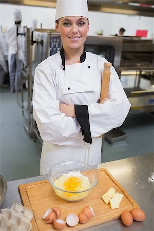 pastry chef uniform for women - Smiling pastry chef with rolling pin making dough Stock Photo - Budget Royalty-Free & Subscription, Code: 400-06863248