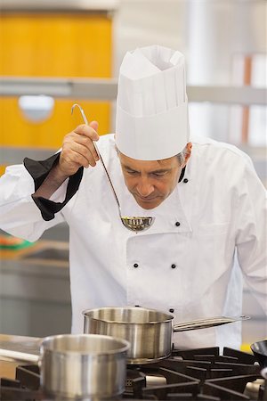 simsearch:6102-03828433,k - Chef about to taste soup in kitchen Stockbilder - Microstock & Abonnement, Bildnummer: 400-06863275