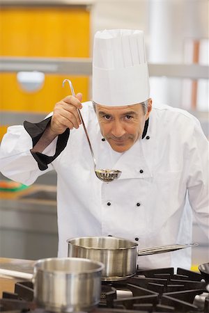 simsearch:6102-03828433,k - Chef tasting his soup in kitchen Stockbilder - Microstock & Abonnement, Bildnummer: 400-06863276