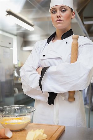 female pastry chef - Serious baker holding rolling pin Stock Photo - Budget Royalty-Free & Subscription, Code: 400-06863284