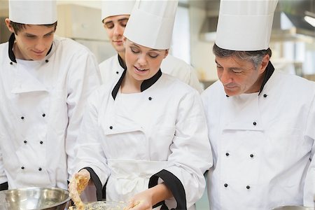pastry chef uniform for women - Trainee Chef's learning how to mix dough in kitchen Stock Photo - Budget Royalty-Free & Subscription, Code: 400-06863294