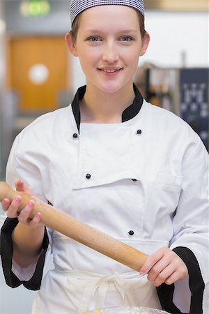 pastry chef uniform for women - Smiling chef holding rolling pin in the kitchen Stock Photo - Budget Royalty-Free & Subscription, Code: 400-06863332