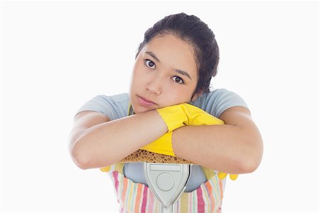 simsearch:400-06863562,k - Sad woman leaning on the mop wearing her apron Stockbilder - Microstock & Abonnement, Bildnummer: 400-06863578