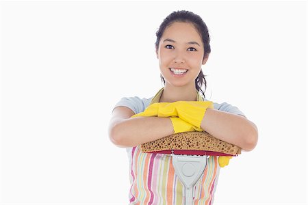 simsearch:400-06863562,k - Happy woman wearing gloves and apron leaning on mop Stockbilder - Microstock & Abonnement, Bildnummer: 400-06863570