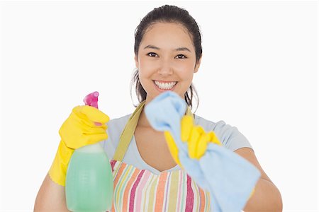 Smiling woman in apron and gloves wiping in front of her Stock Photo - Budget Royalty-Free & Subscription, Code: 400-06863595