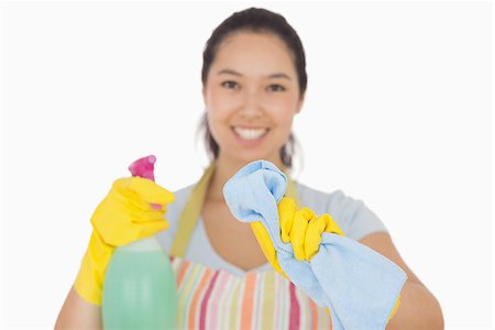 Happy woman in apron wiping with cloth in front of her Stock Photo - Budget Royalty-Free & Subscription, Code: 400-06863596