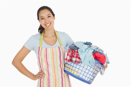 Happy woman in apron holding full laundry basket Stock Photo - Budget Royalty-Free & Subscription, Code: 400-06863711